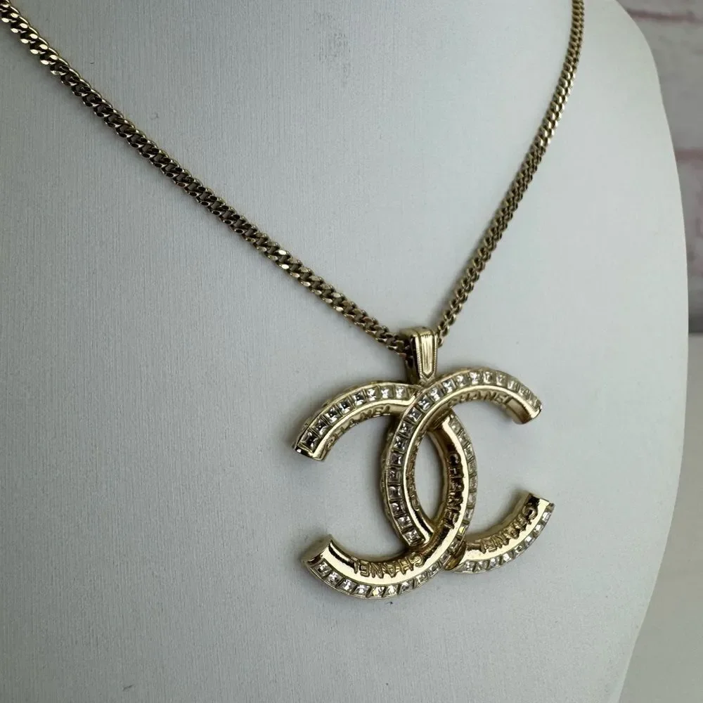 CHANEL Multi Logo Engraved Gold Crystal CC Pendant Necklace